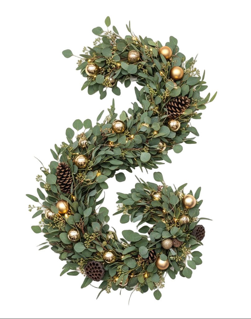 A Glowing Garland with Golden Baubles - Florist London